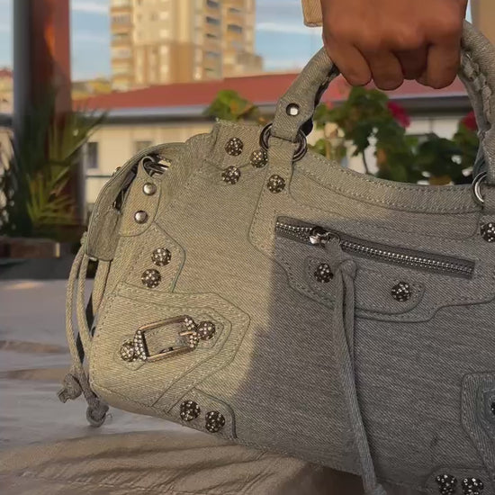 Up close view of the Greta Denim Metallic Hand Bag